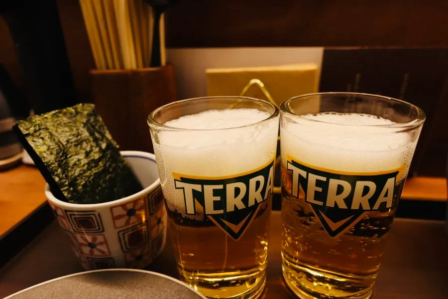 Cold draft beer enjoyed alongside the kaisendon