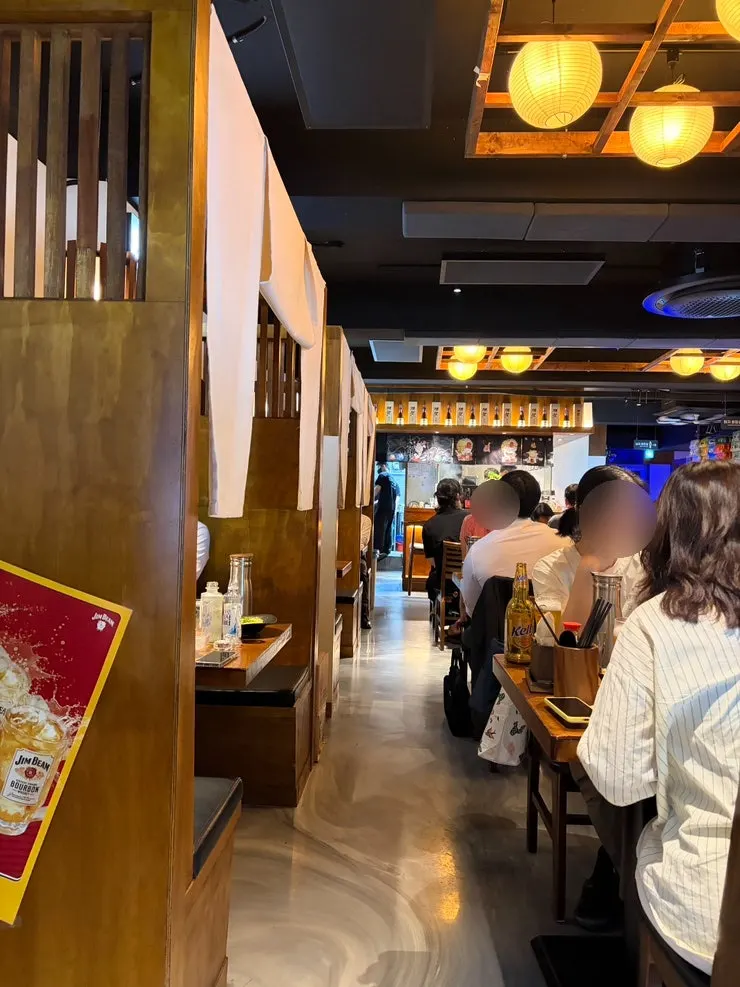 Interior tables at Izakaya Goko Gangnam Sinnonhyeon Branch