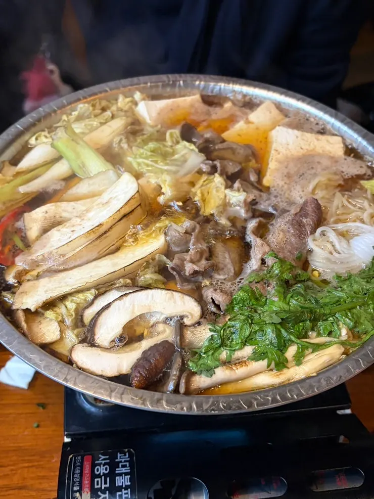 Pot of goko sukiyaki with sweetish broth
