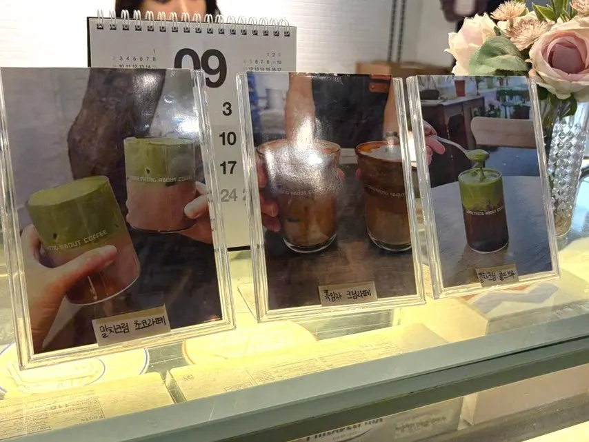 Slices of cake lined up in the display case