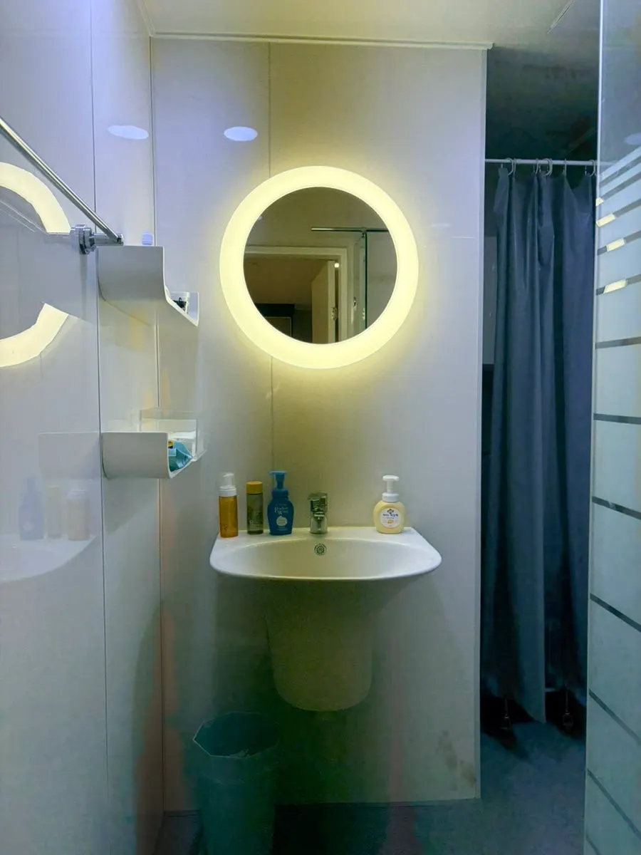 Mirror and sink inside the cleansing room