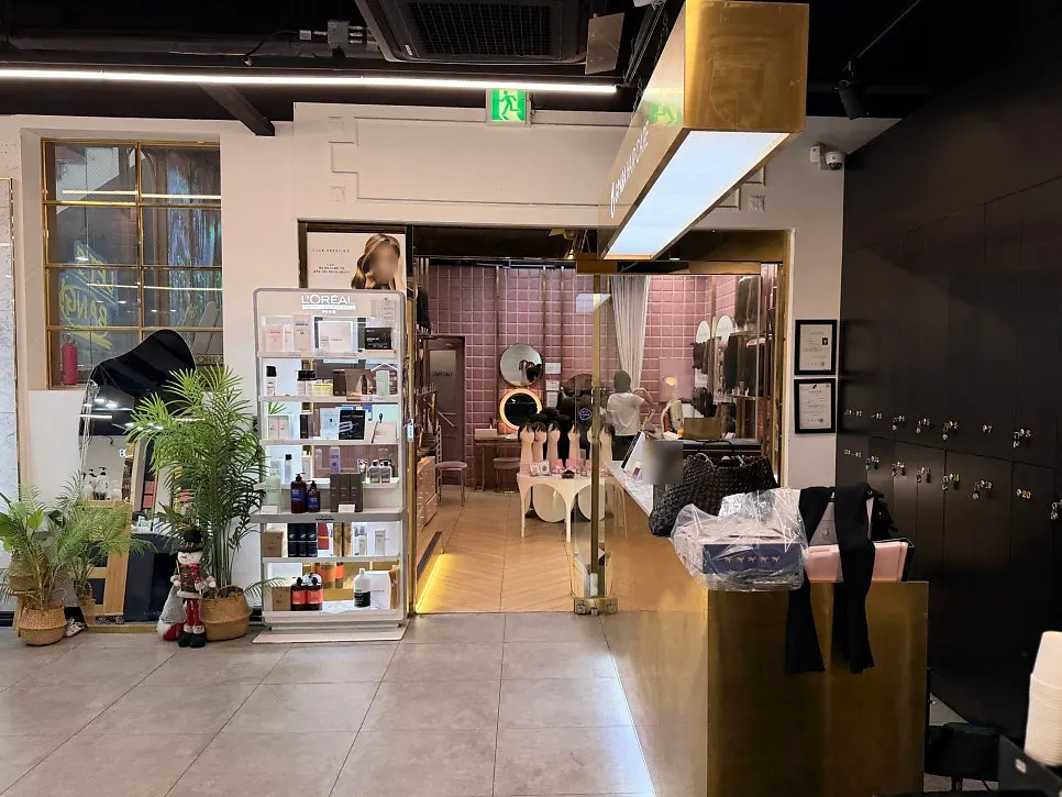 Basement-level salon entrance and interior view