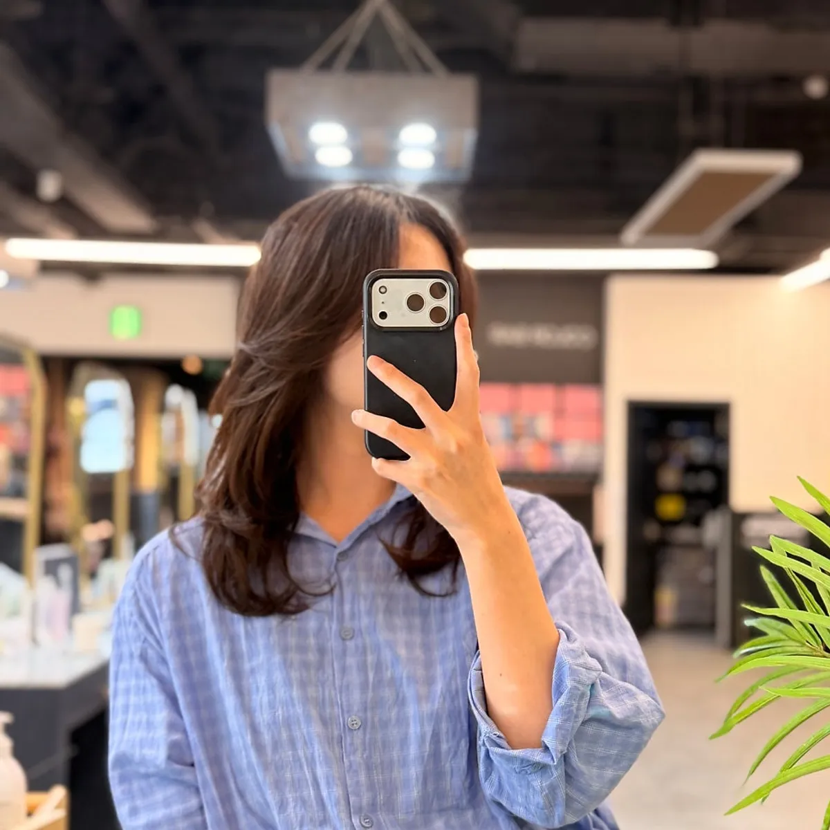 Layered hair finished with a perm that looks like it was styled with an iron