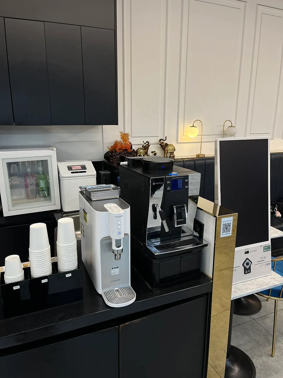 Drink station and waiting area toward the back of the salon