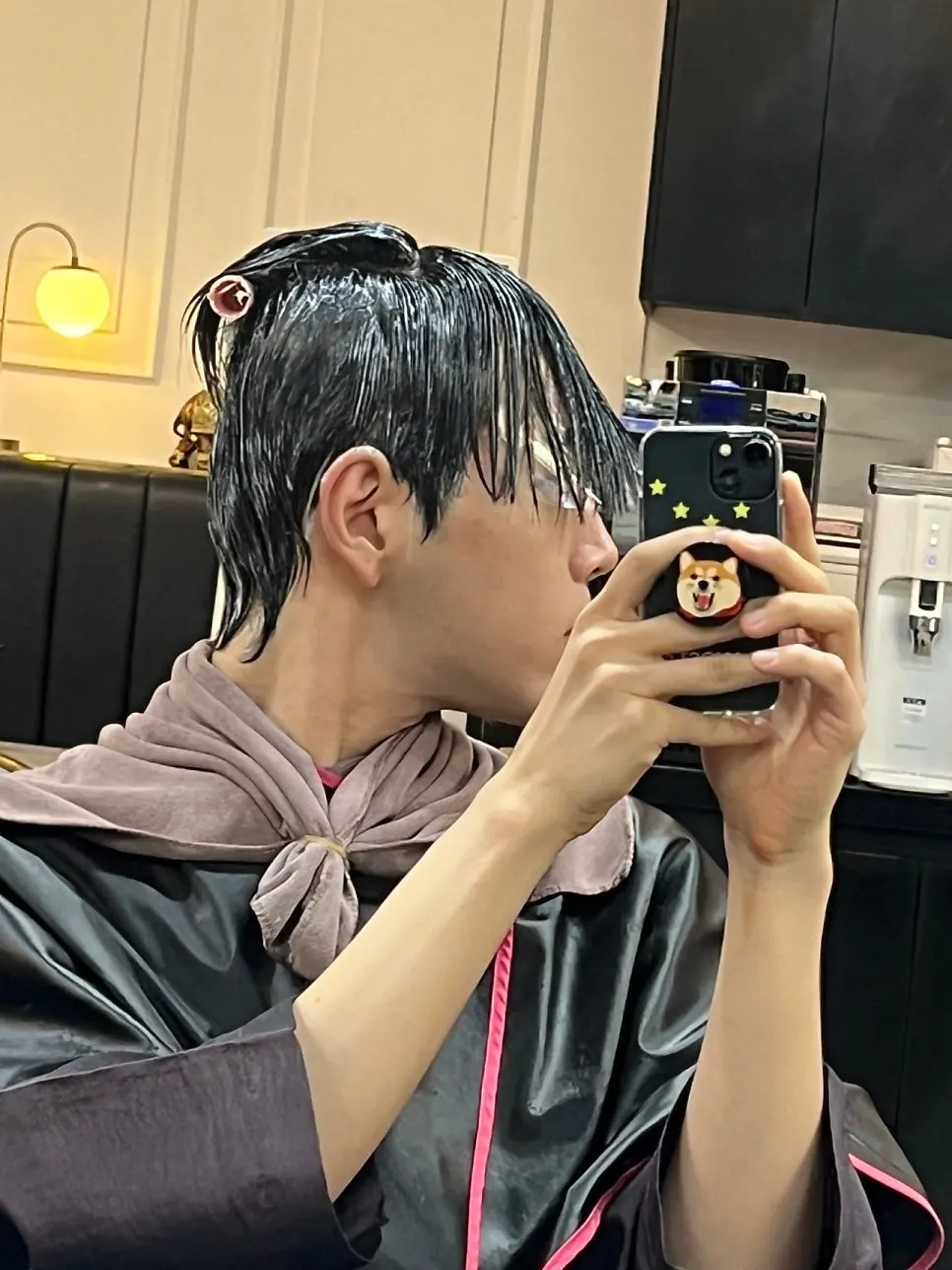 Applying down perm solution to the side hair