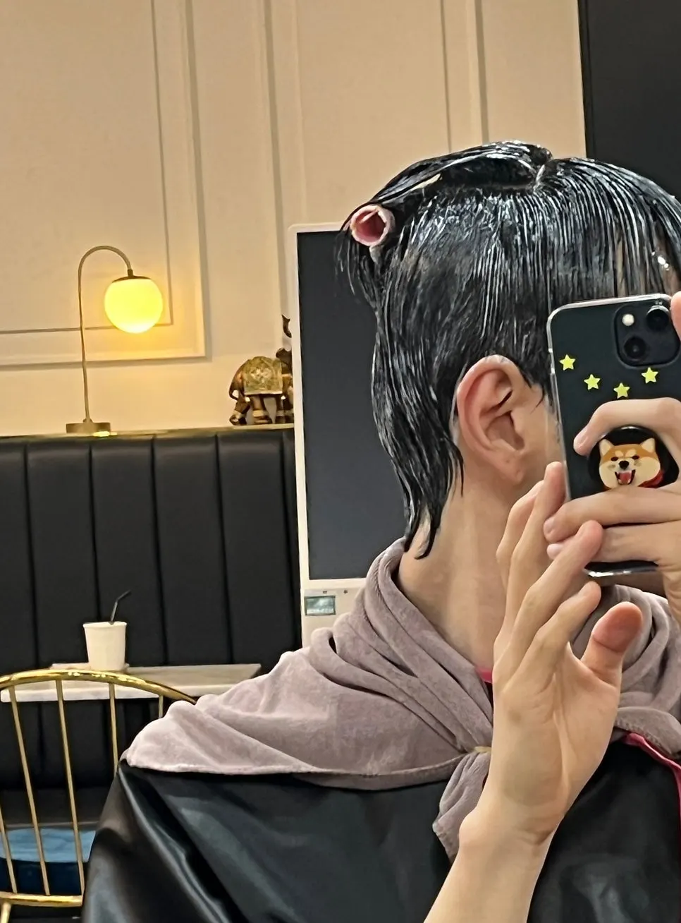 Checking hair condition midway through the down perm