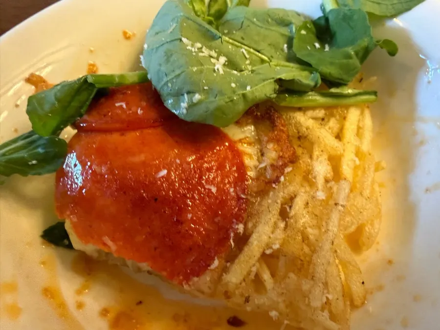 Arugula cheese potato pancake topped with arugula