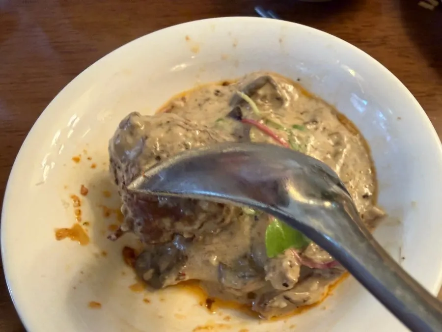 Truffle cream meatballs revealed under thick sauce
