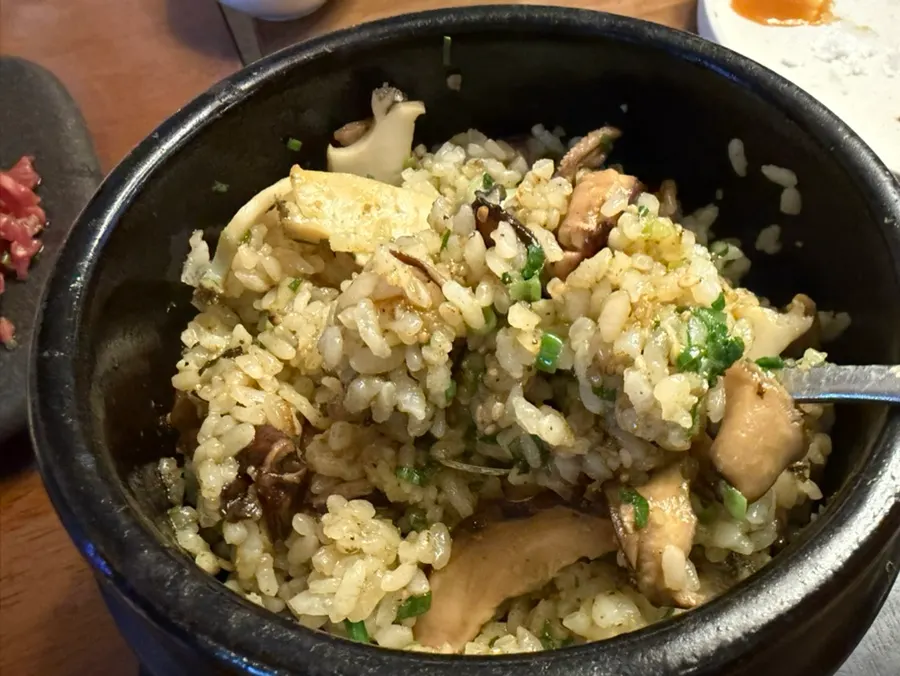 Abalone mushroom butter pot rice topped with abalone and mushrooms
