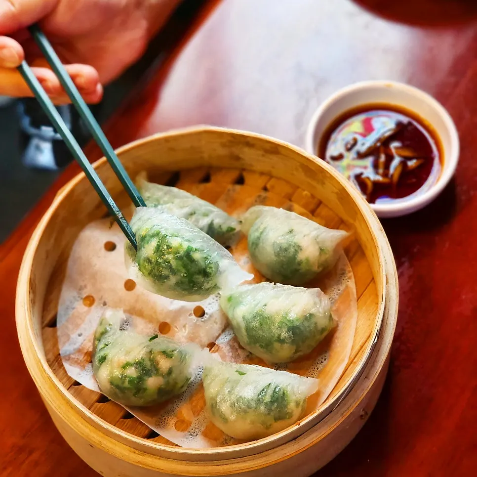 A crystal moon dumpling split open to reveal the filling