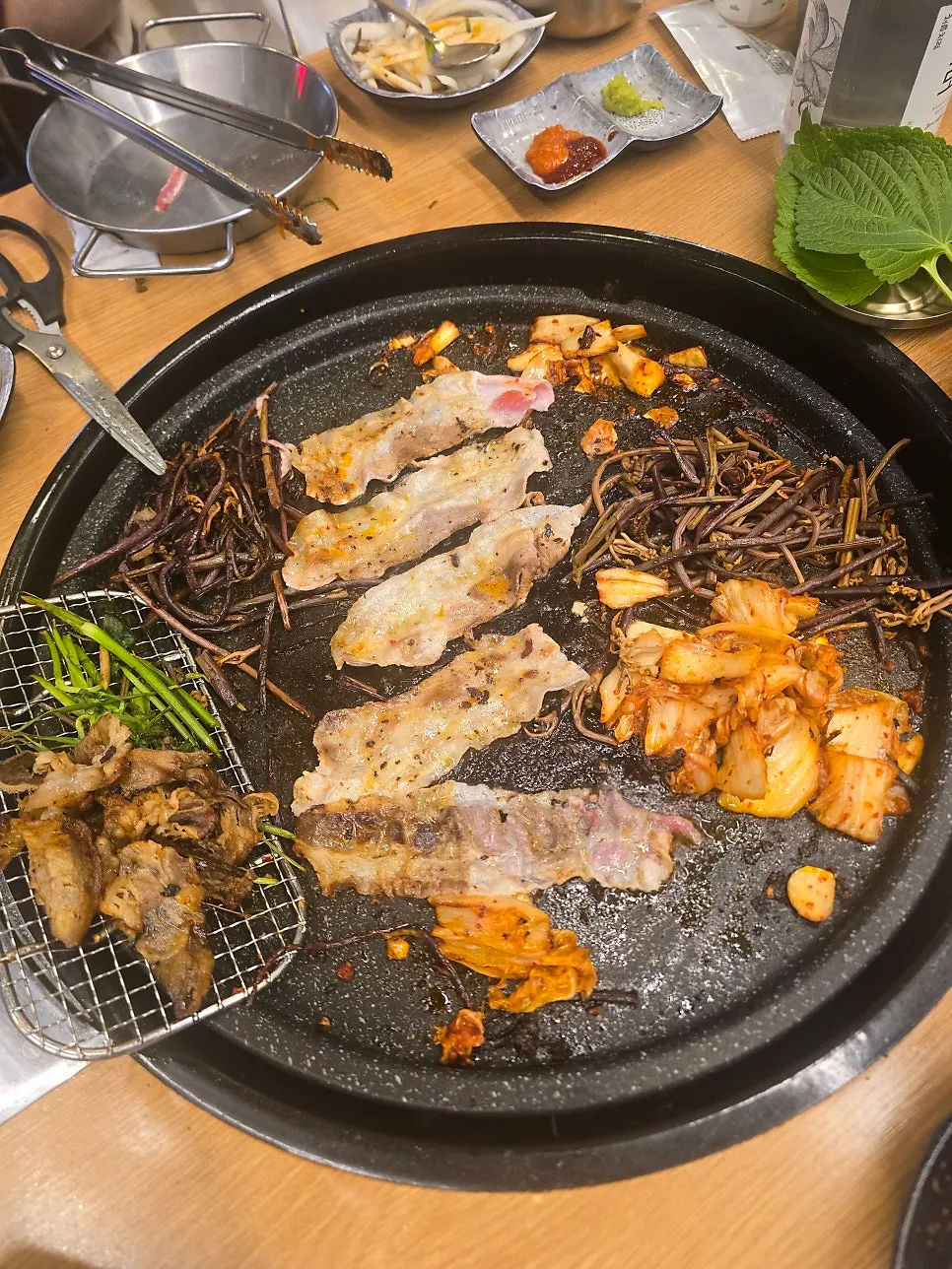Extra grilled meat and side dishes on the table