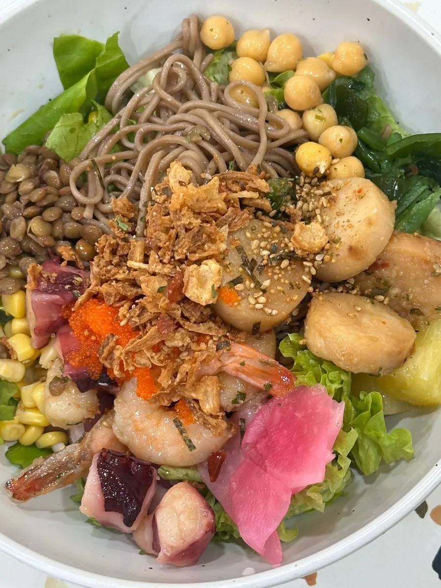 Seafood poke topped with chili garlic mayo