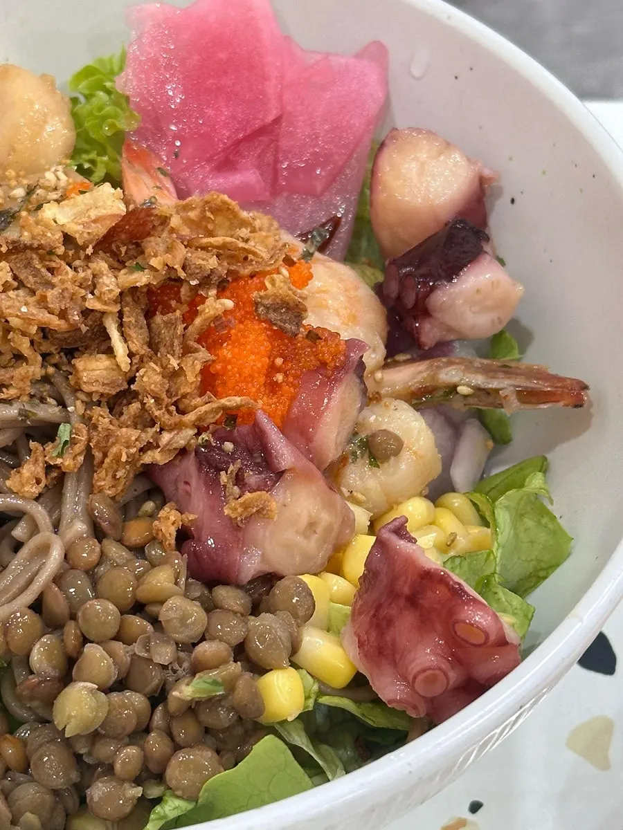 Seafood poke toppings with octopus, scallop, and flying fish roe