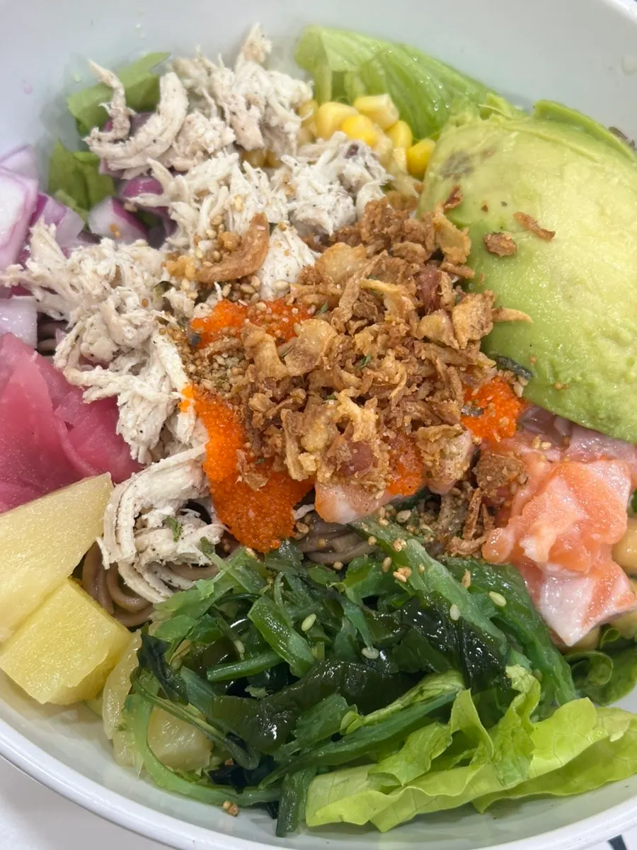 Super Protein poke topped with salmon, chicken breast, and avocado