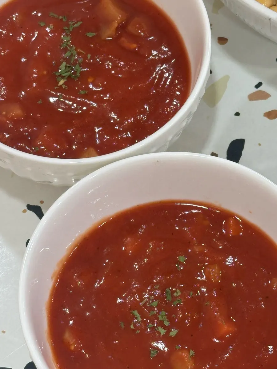 Spicy vegan tomato soup served alongside the poke