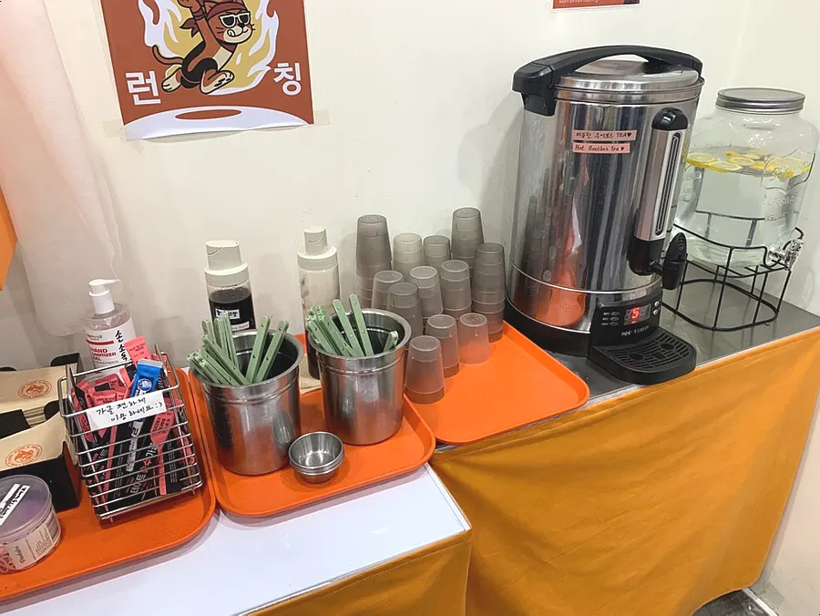 Self-serve bar with water, mouthwash, and hair ties