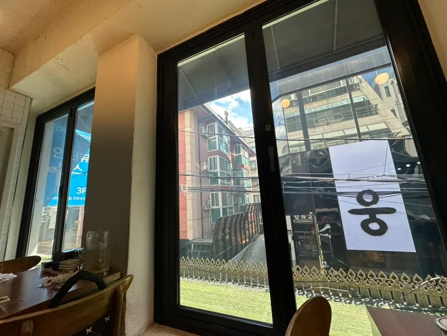 Spacious regular table seating by windows