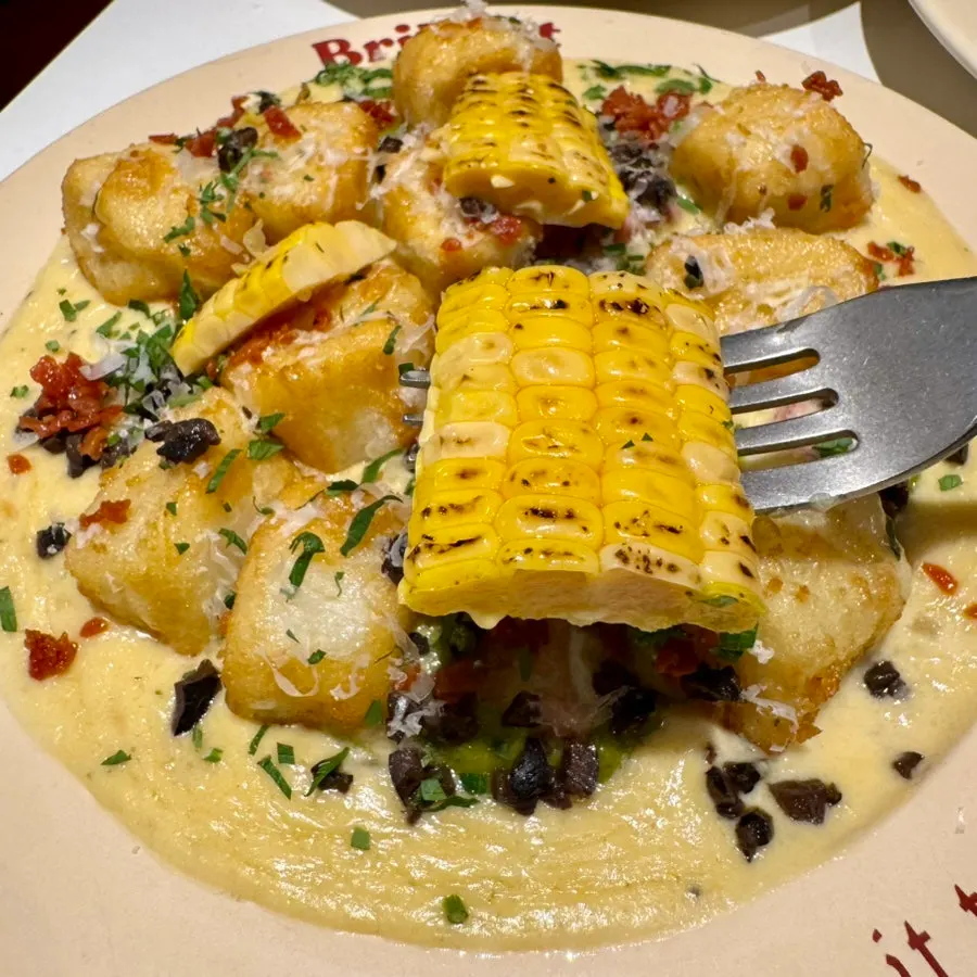Close-up of corn-topped cream gnocchi