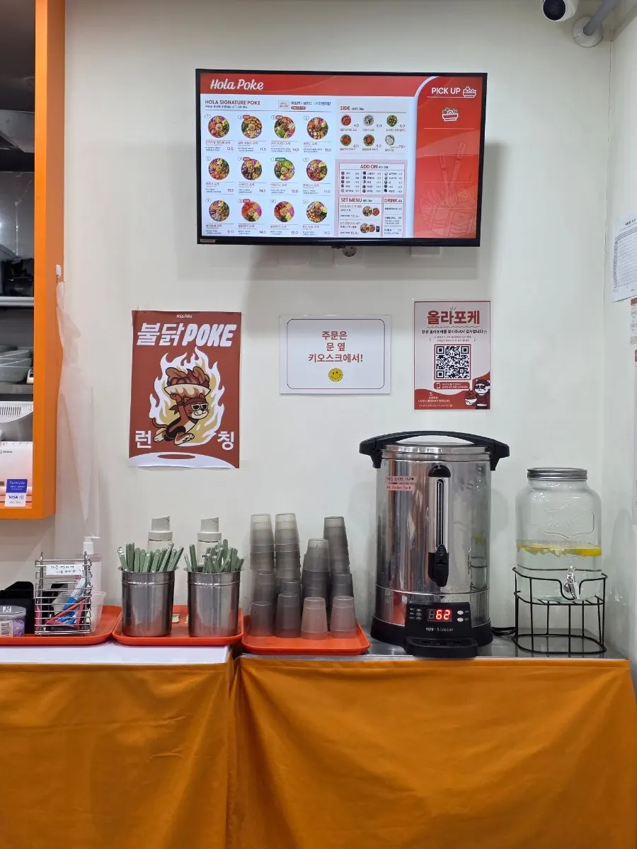 Self-serve bar with lemon water and goji berry tea