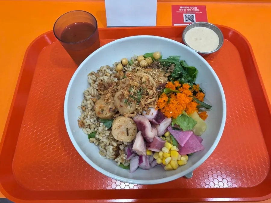 Tray with seafood poke and goji berry tea