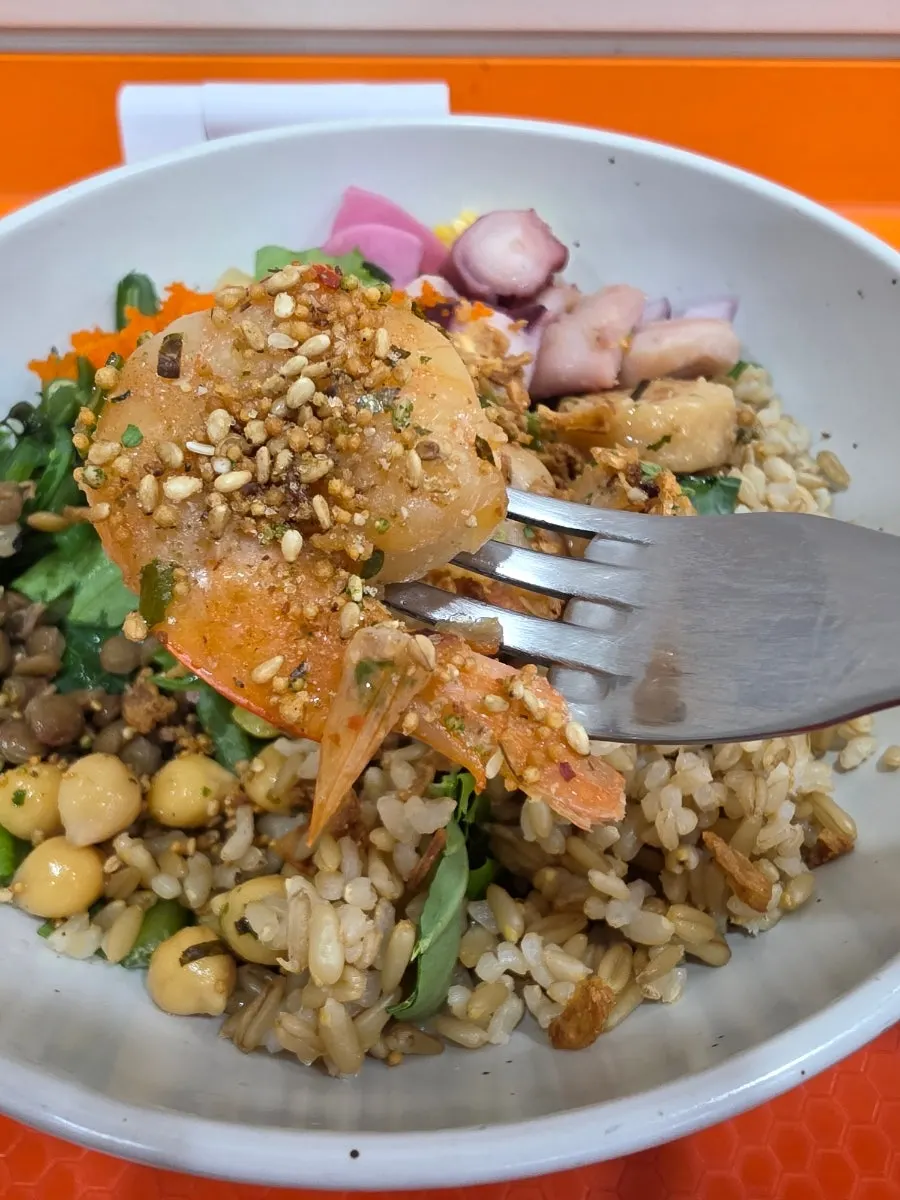 Seafood poke topped with shrimp, scallop and octopus