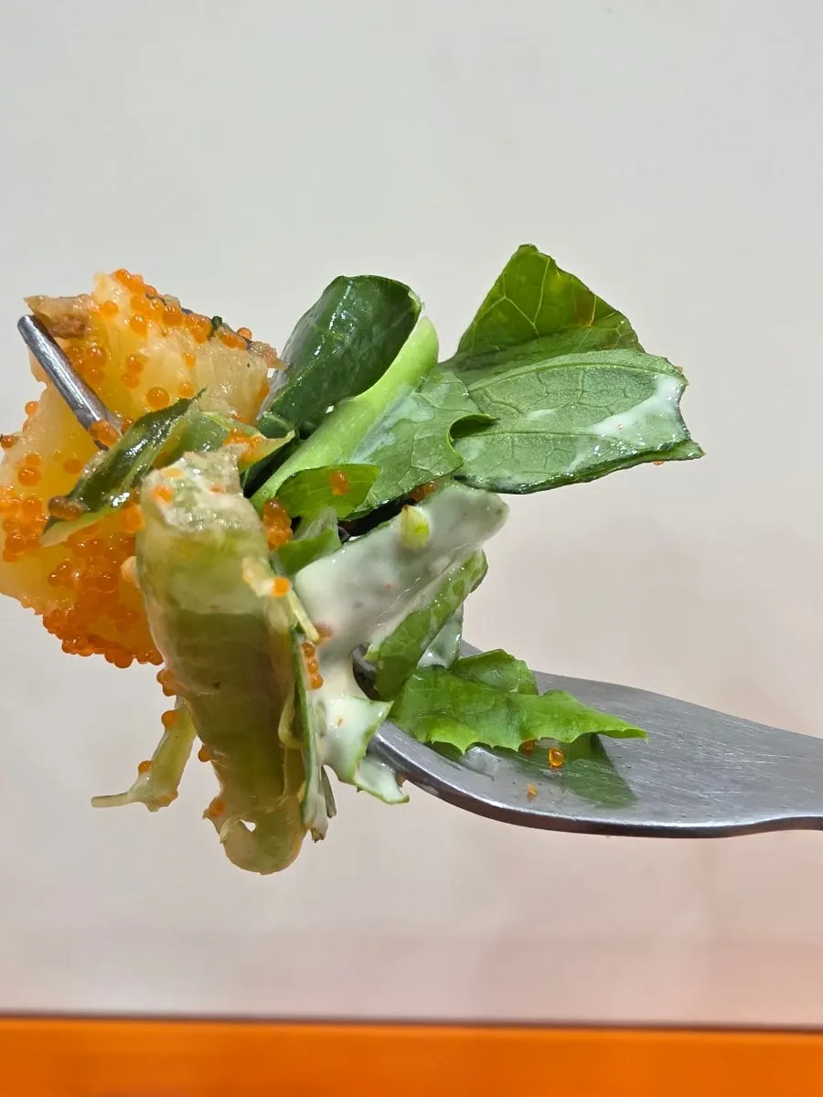 Close-up of seafood poke tossed in sauce