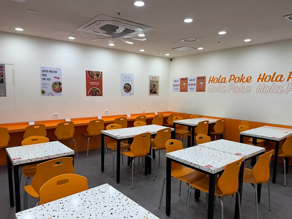 Table seat at Ola Poke with an outlet