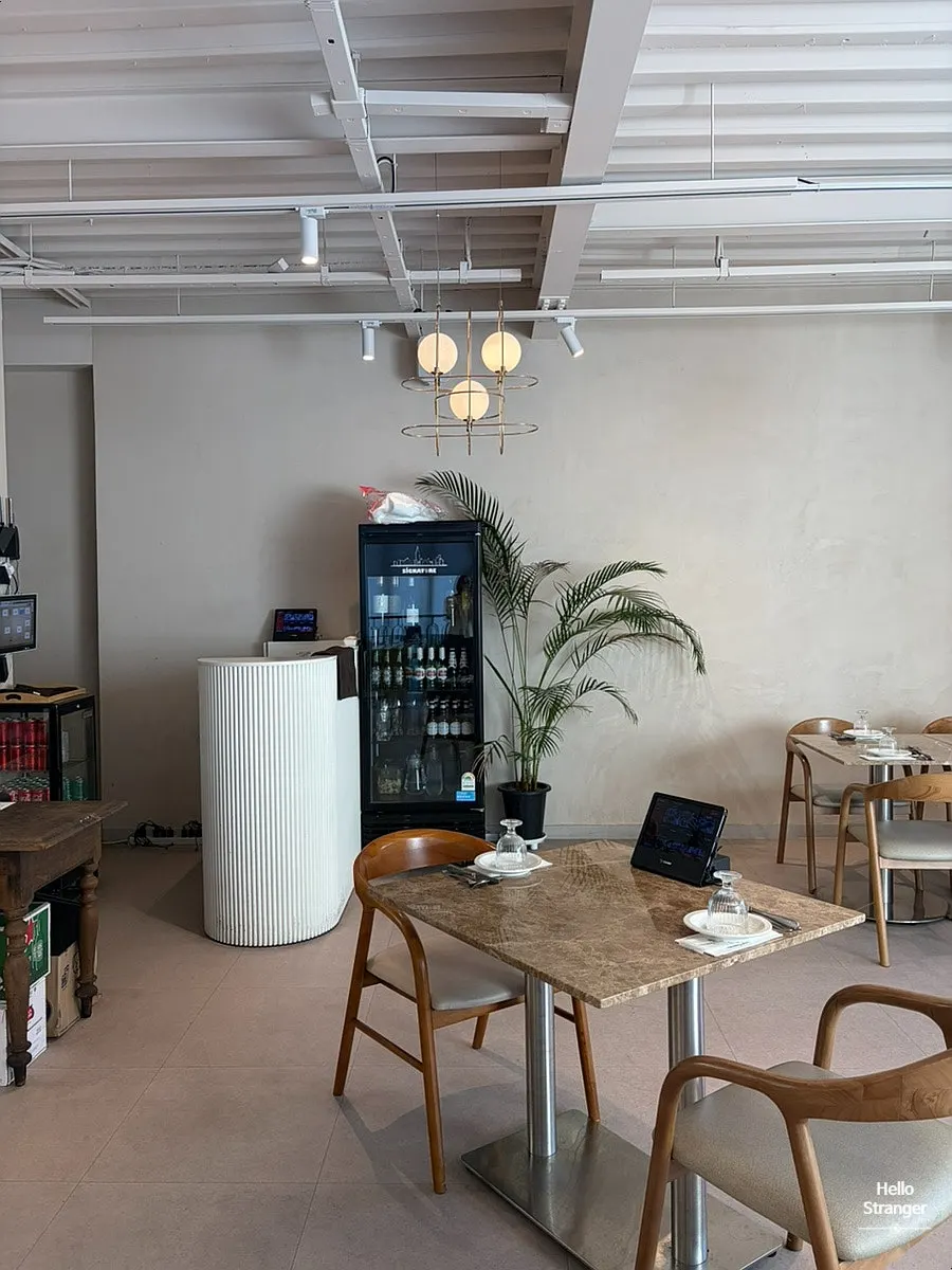 Second-floor seats with sunlight through full-height windows