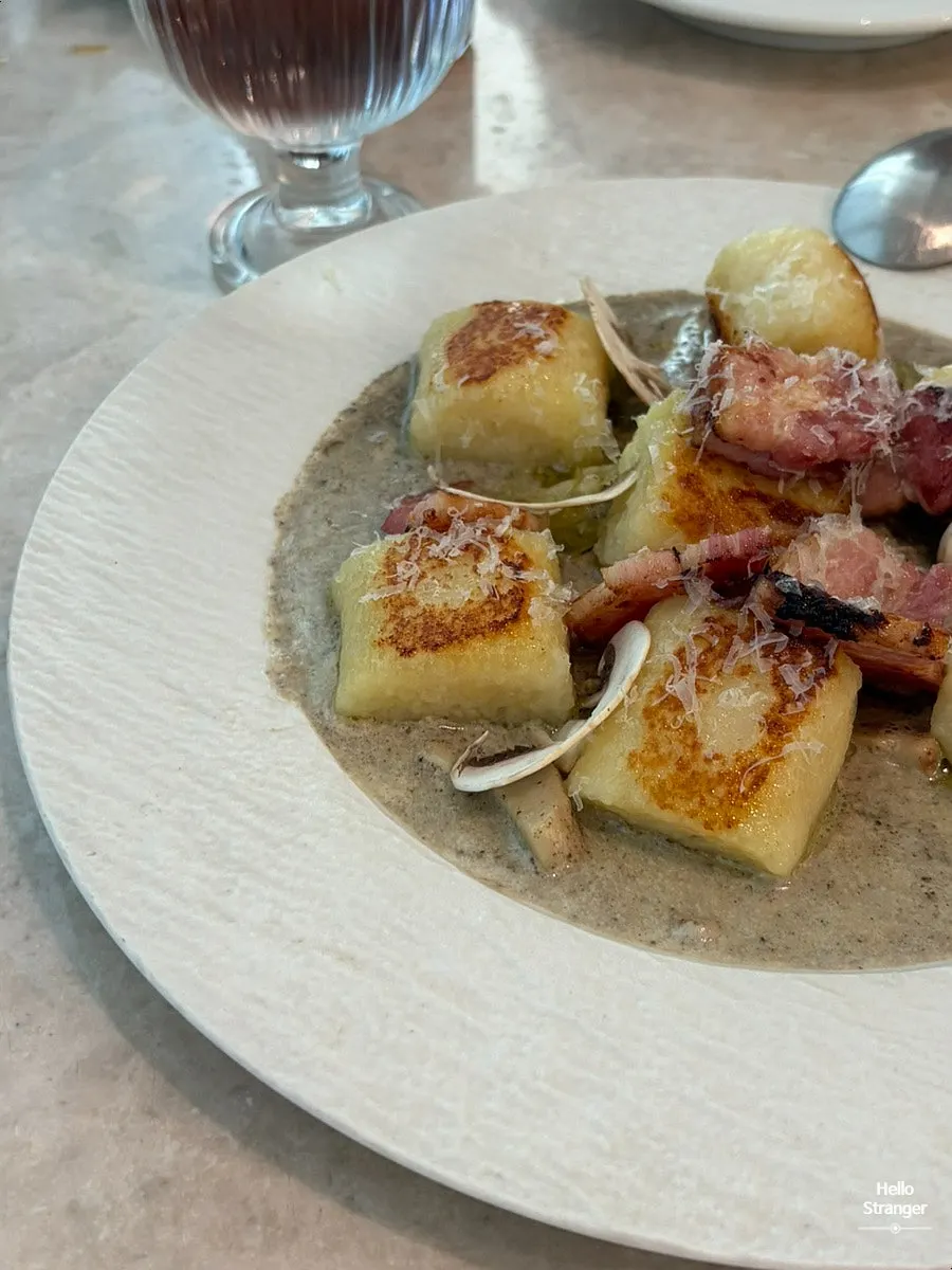 Gnocchi with truffle cream sauce and bacon