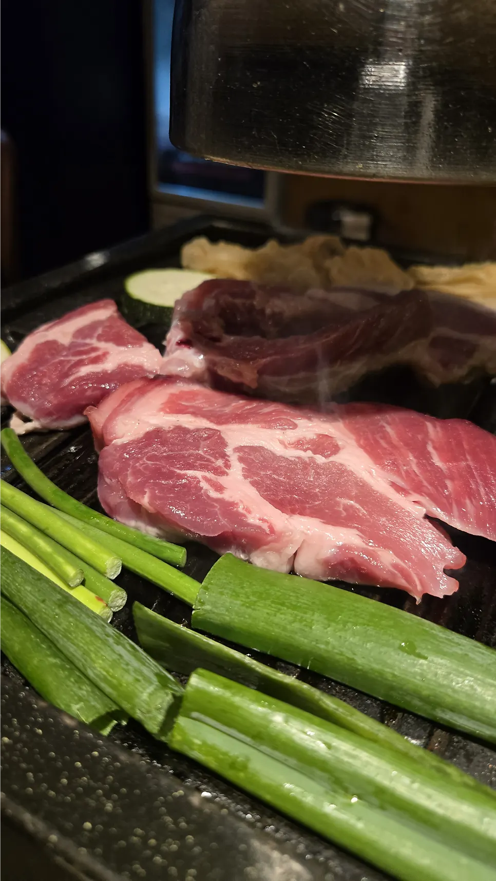 Staff grilling pork belly