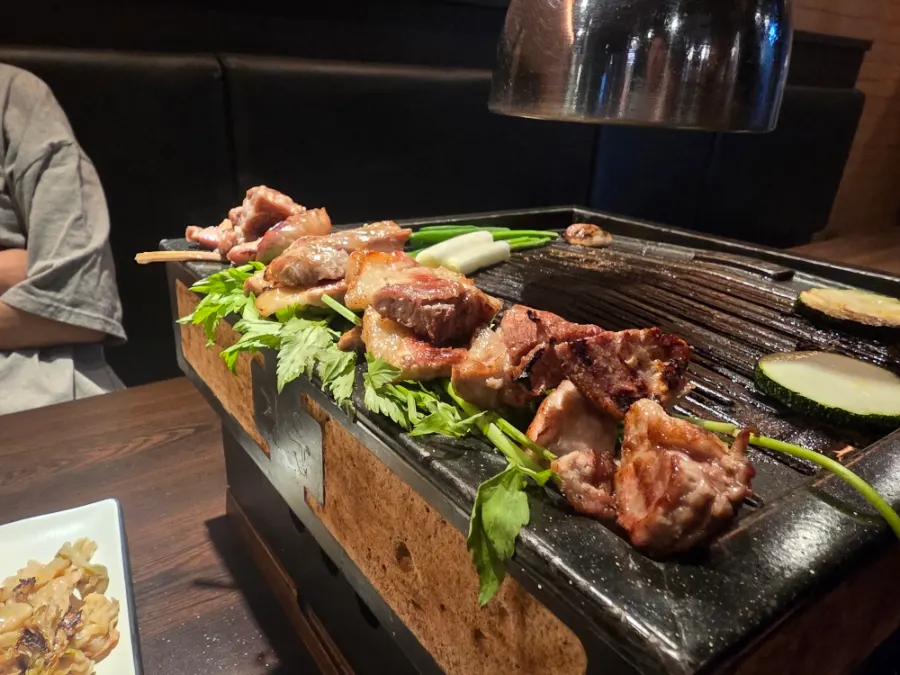 Cooked meat placed over vegetables