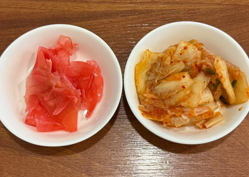 Kimchi, ginger, and pickled radish accompaniments