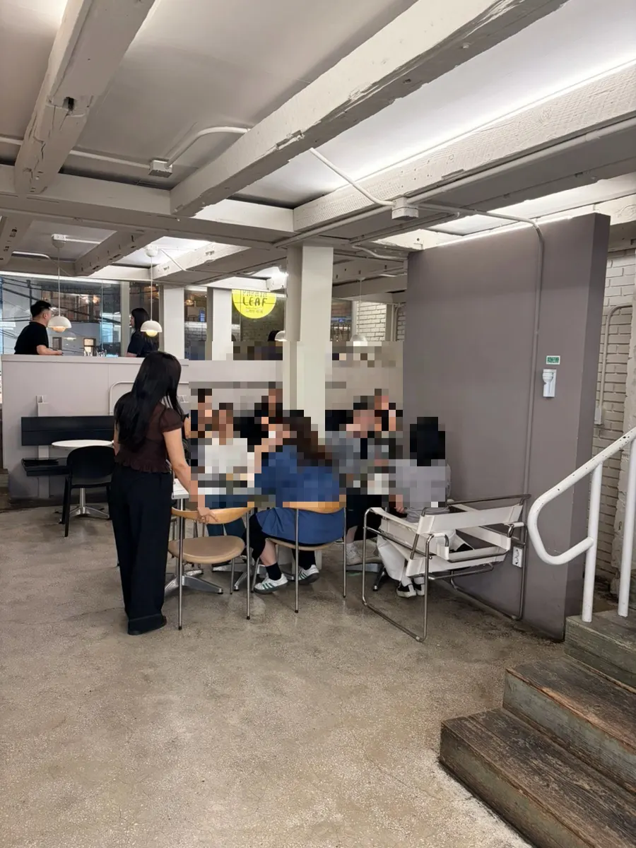 Interior of Upper and Under mixing white tones and wood