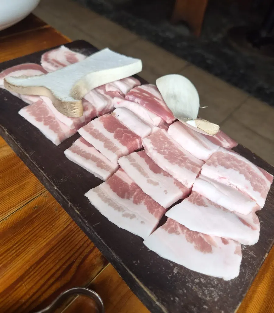 Plate of raw pork belly, 2 servings at Bongu Hwarro