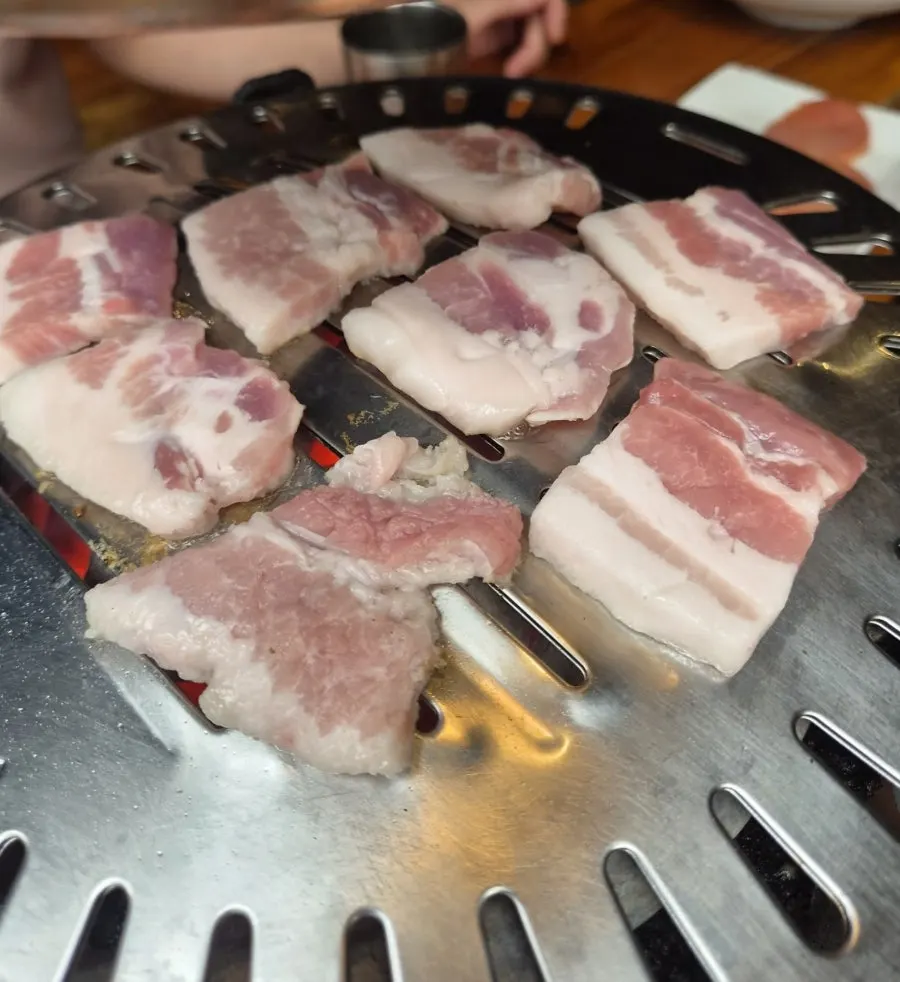 Pork belly placed on the brazier grill plate