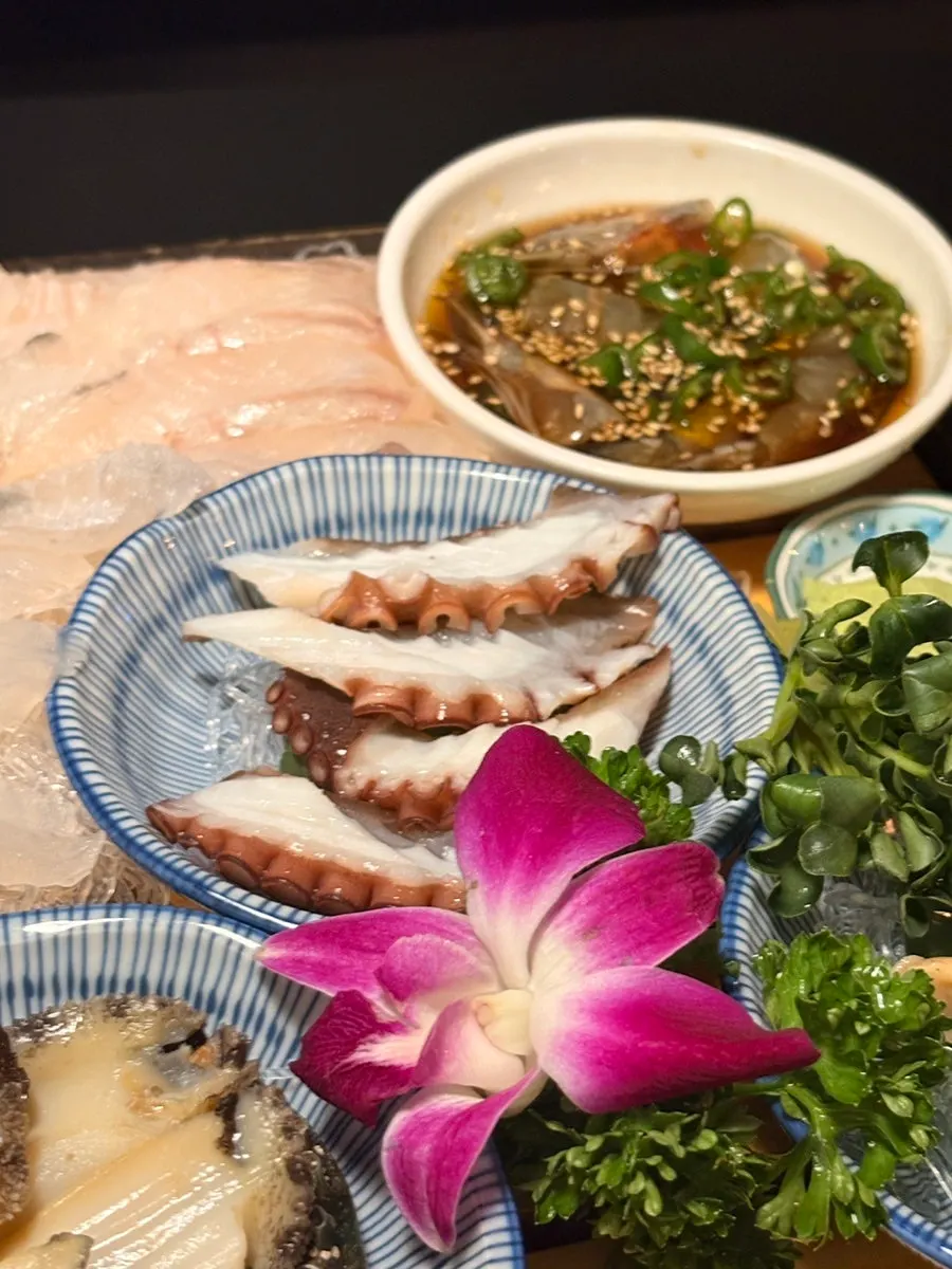 Assorted sashimi including sea bream and large halibut