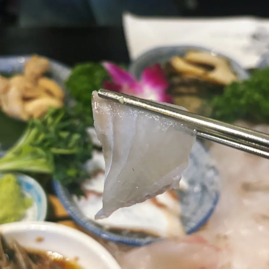 Thin, long slices of fluke sashimi
