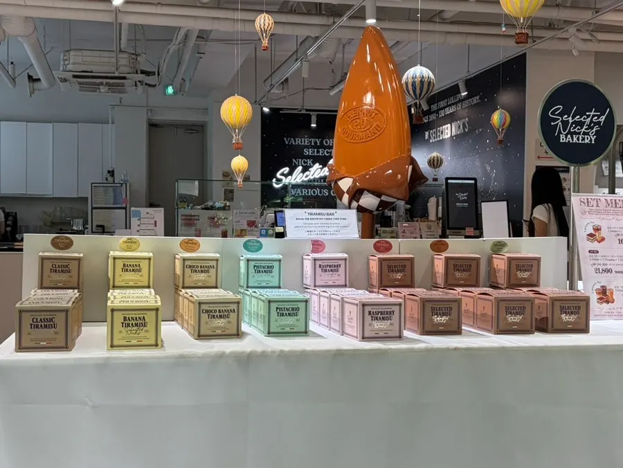 Showcase displaying handmade tiramisu at Selected Nicks
