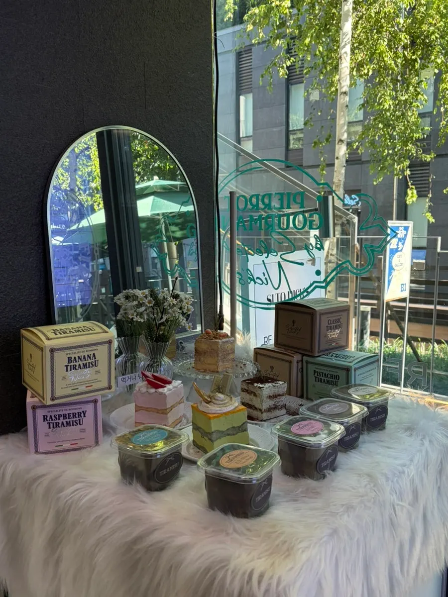 Baked goods display including financiers and madeleines
