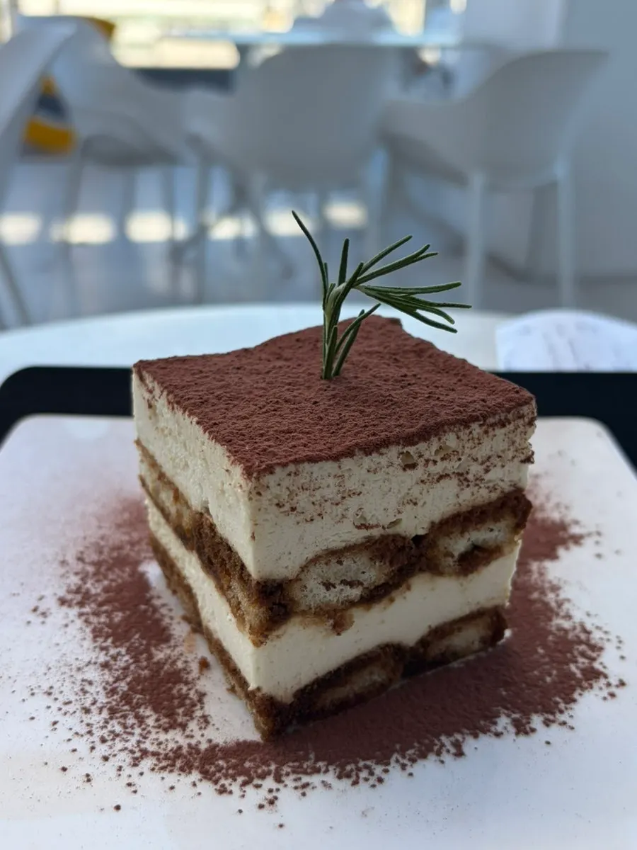 Classic tiramisu topped with plenty of cocoa powder