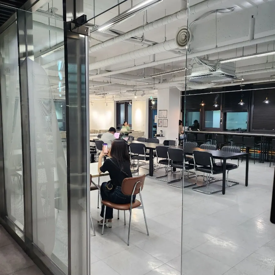Bar-style seating with generous table spacing