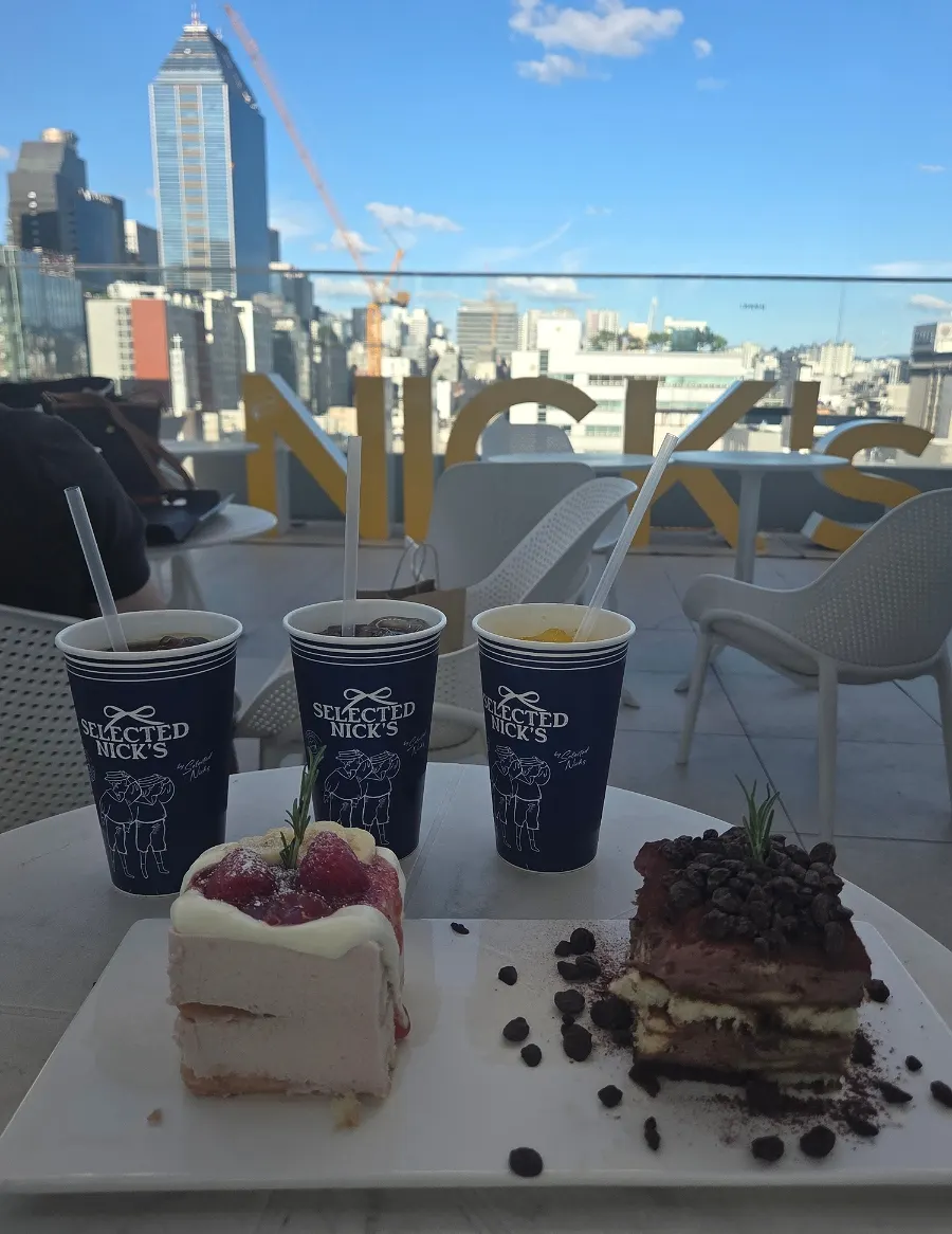 Tiramisu and drinks set on a rooftop table