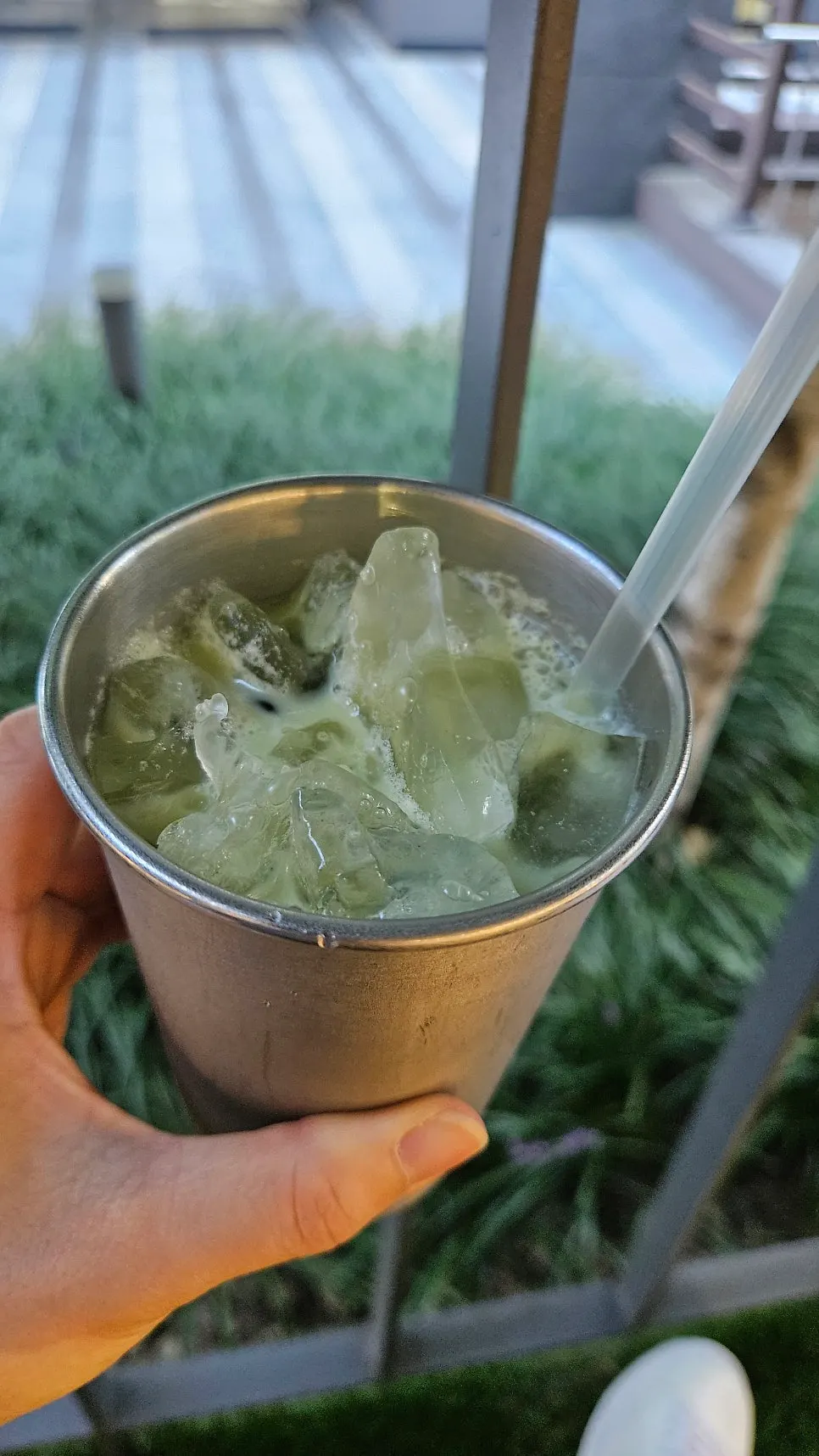 A deep-colored iced matcha latte