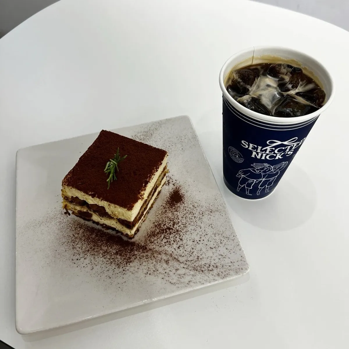 Classic tiramisu and iced Americano