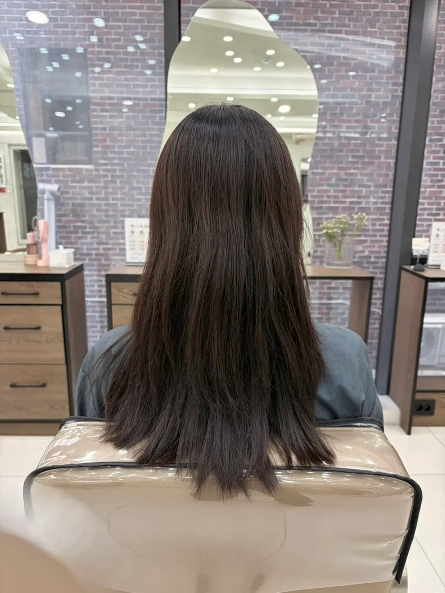 After-clinic hair being swept through with a hand