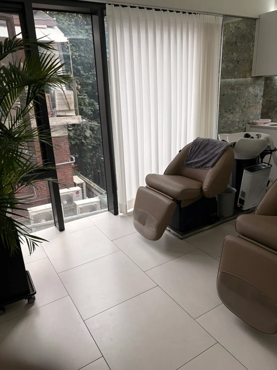 Spacious, clean treatment area and shampoo room