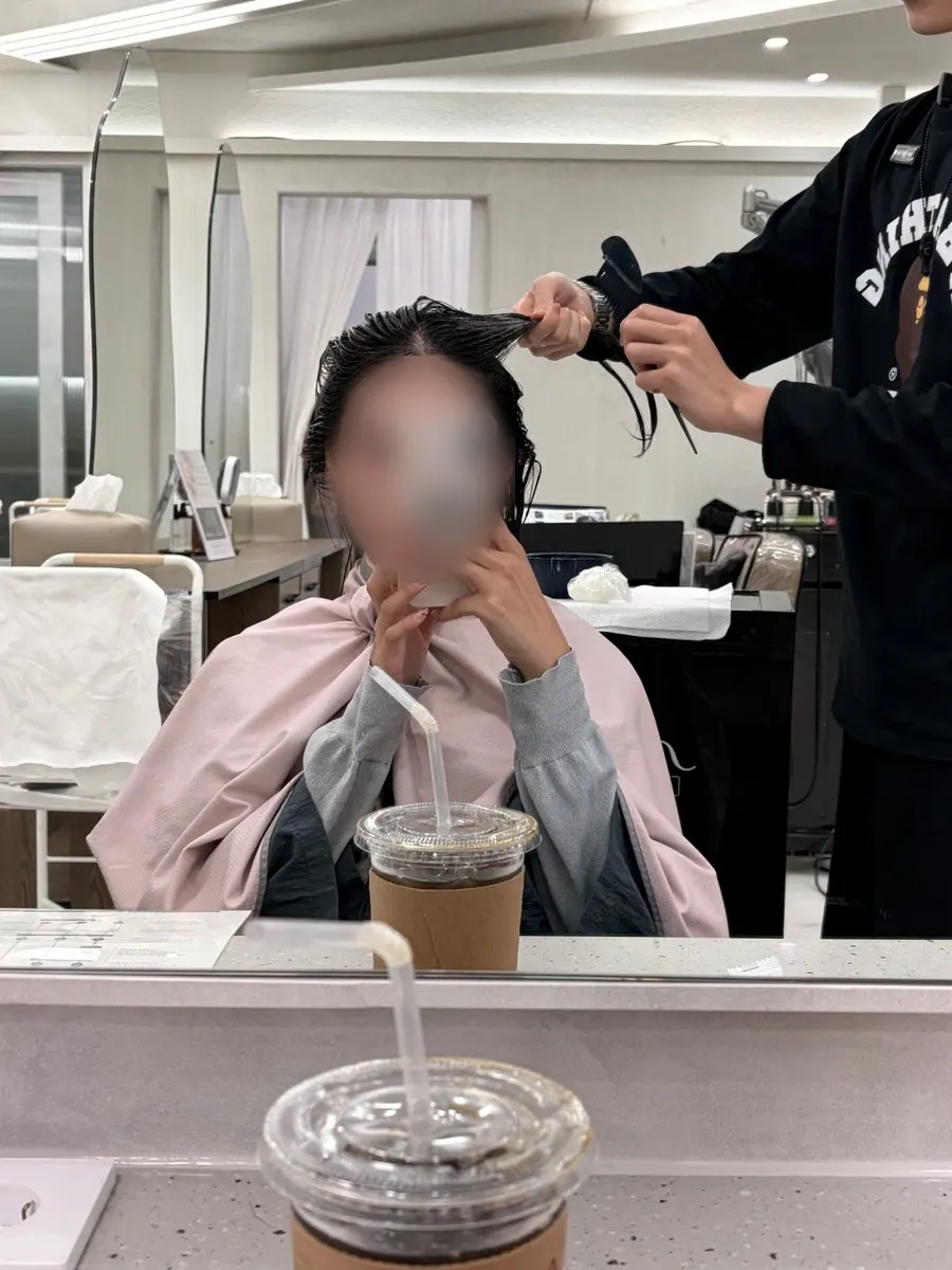 Applying product 2 formula all over the hair