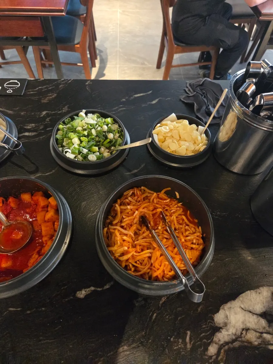 Sauces and seasonings at the self-serve bar