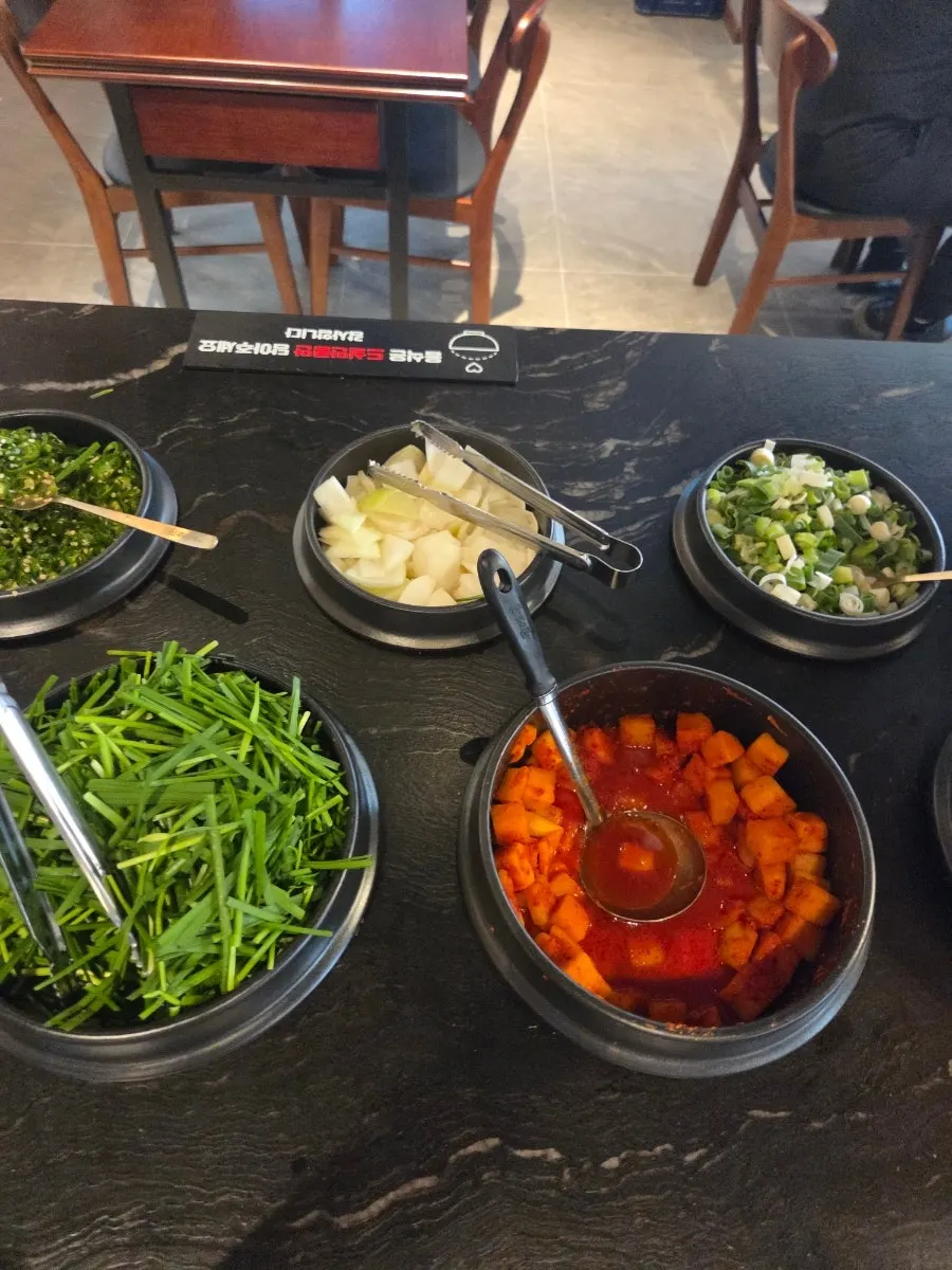 A plate of side dishes gathered from the self-serve bar