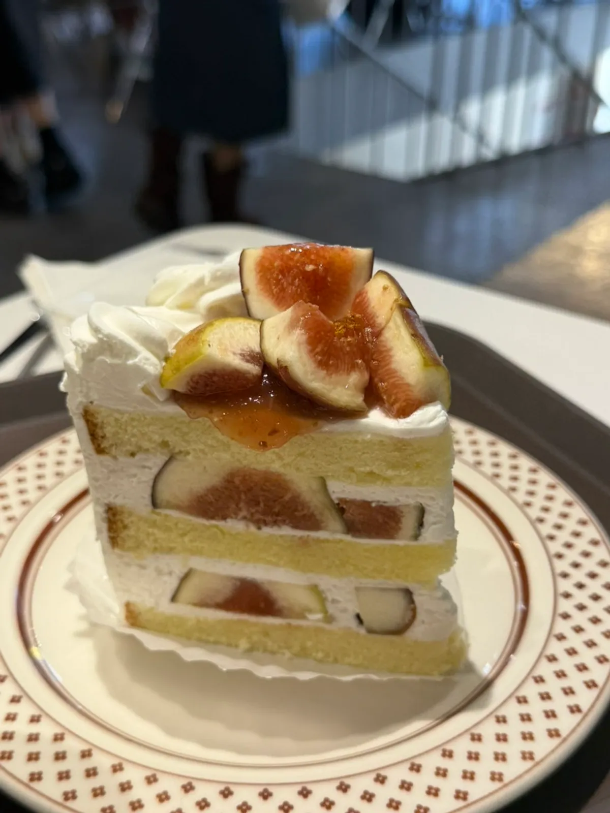 Cross-section of the fresh cream cake showing bits of fig
